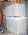 Concrete crawl space support posts in Greely that are showing signs of failure as they sink into the earth.