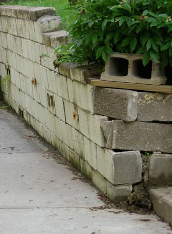 collapsing retaining wall with severe damage in Embrun