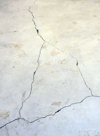 severely cracked, heaving slab floors in a home in Carlsbad Springs