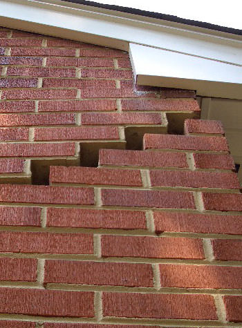 photo of a rotating foundation wall with cracks in Sarsfield
