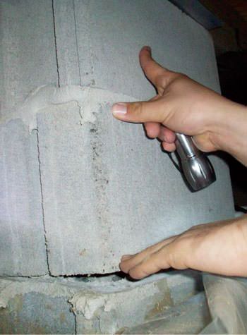 a completely failing concrete crawl space support pillar in Edwards