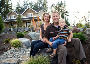 A happy family outside a home with a repaired foundation in Carlsbad Springs