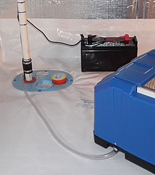 Closeup of a crawl space sump pump installed in Carleton Place