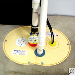 A sump pump system installed along a basement floor in Ottawa.