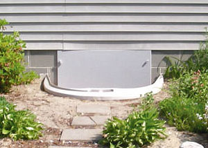 Rigid plastic crawl space access well installed in a Orleans crawl space