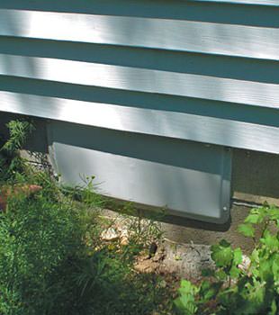 A gray crawl space vent cover in Greely