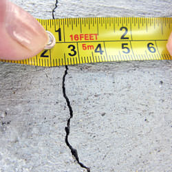 A crack in a poured concrete wall that's showing a normal crack during curing in Edwards