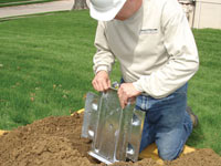 Fastening an earth anchor for a severely bowing wall in Carleton Place.