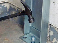 Mounting a foundation channel anchor installation to the floor in Smiths Falls.