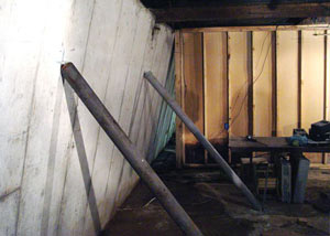 A severely tilting foundation wall propped up by steel beams in Crysler.