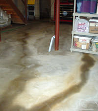 Flooding entering a basement through a floor crack in Cumberland