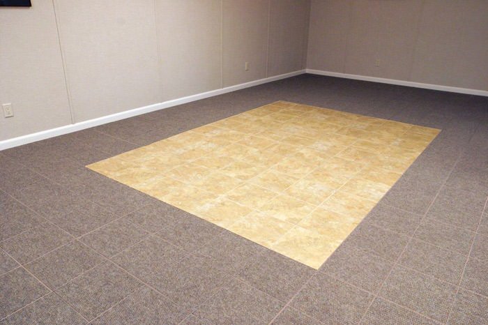 tiled and carpeted basement flooring installed in a Gloucester home