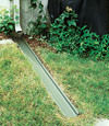 A recessed gutter drain extension installed in Edwards, Ontario