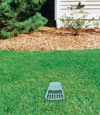 A buried gutter drain downspout extension installed in a Edwards home