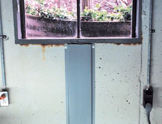 Repaired waterproofed basement window leak in Brockville